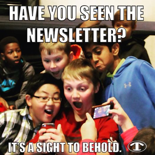 Kids Looking at a Mills Elementary newsletter