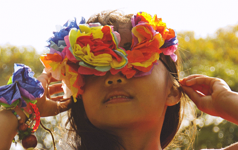 A woman wearing flowers in her hair