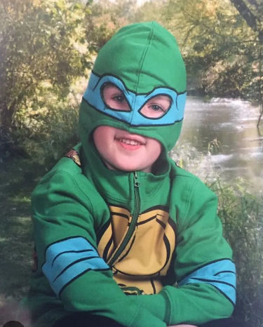 Boy dressed as a ninja turtle